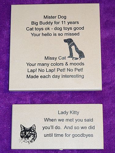 Sample memorial tiles: a 6 by 6 inch tile engraved with Mister Dog — Big Buddy for 11 years — Cat toys ok - dog toys good — Your hello is so missed and Missy Cat — Your many colors and moods — Lap! No Lap! Pet! No Pet! — Made each day interesting with a dog silhouette, and a 3 by 6 inch tile engraved with Lady Kitty — When we met you said you will do. And so we did until time for goodbyes with a cat face illustration, shown on a purple background